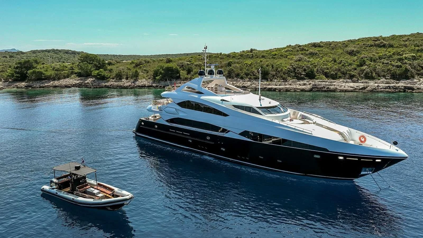 a boat and a small boat in the water aboard KATARIINA I Yacht for Sale