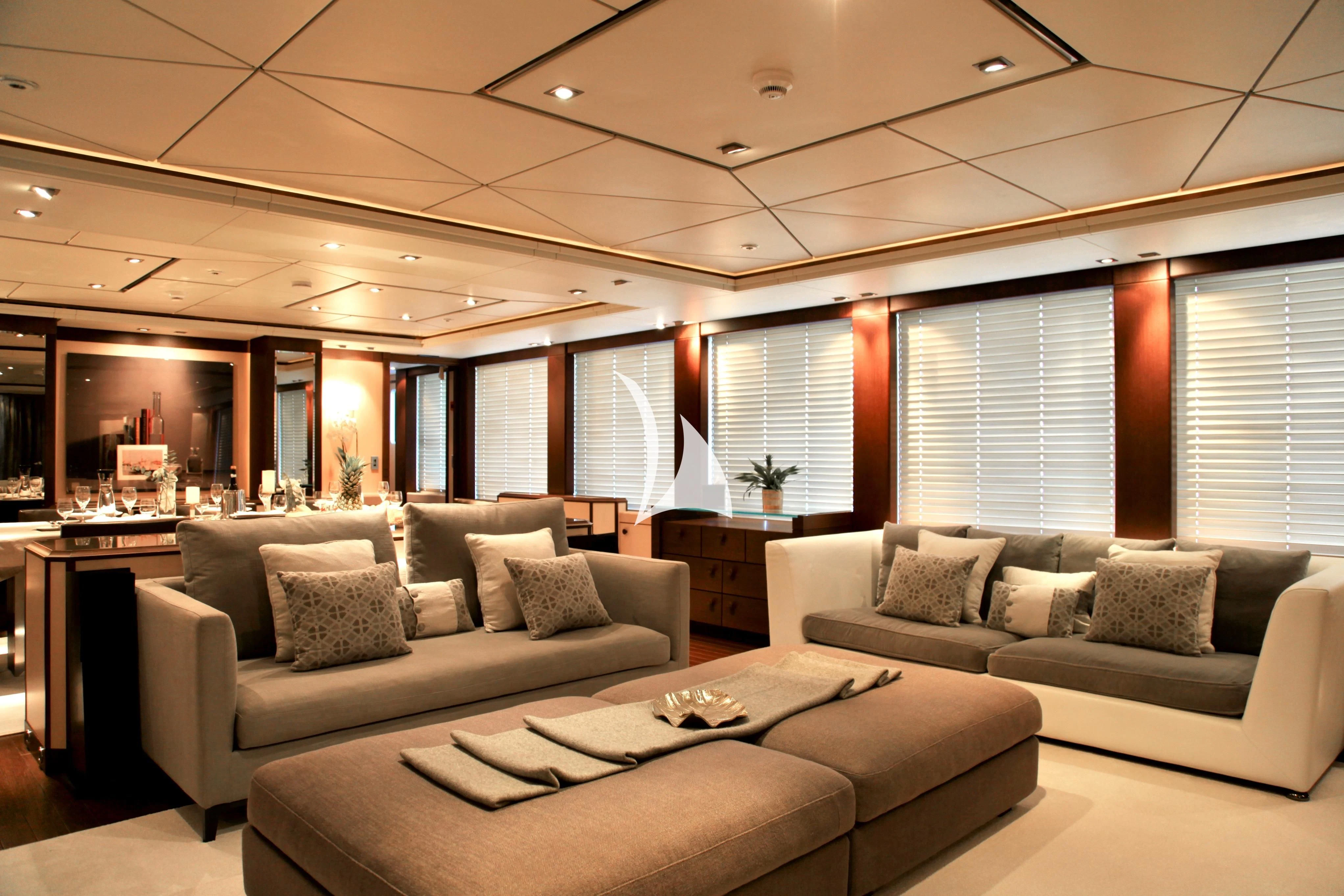 a living room with a couch and a table aboard ALALYA Yacht for Sale