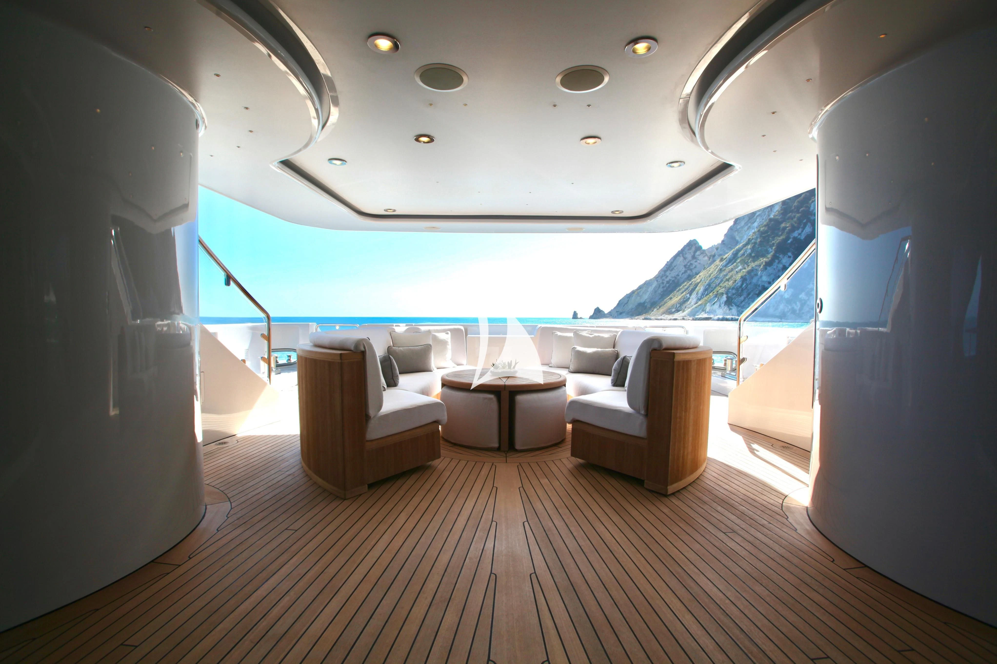 a room with a wood floor and a large window with a view of the ocean aboard ALALYA Yacht for Sale