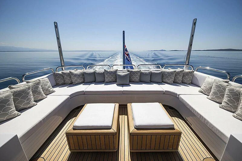 a boat with a flag on the deck aboard ALALYA Yacht for Sale