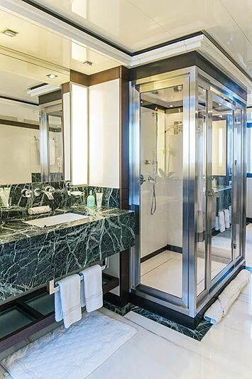 a bathroom with a glass shower aboard ALALYA Yacht for Sale
