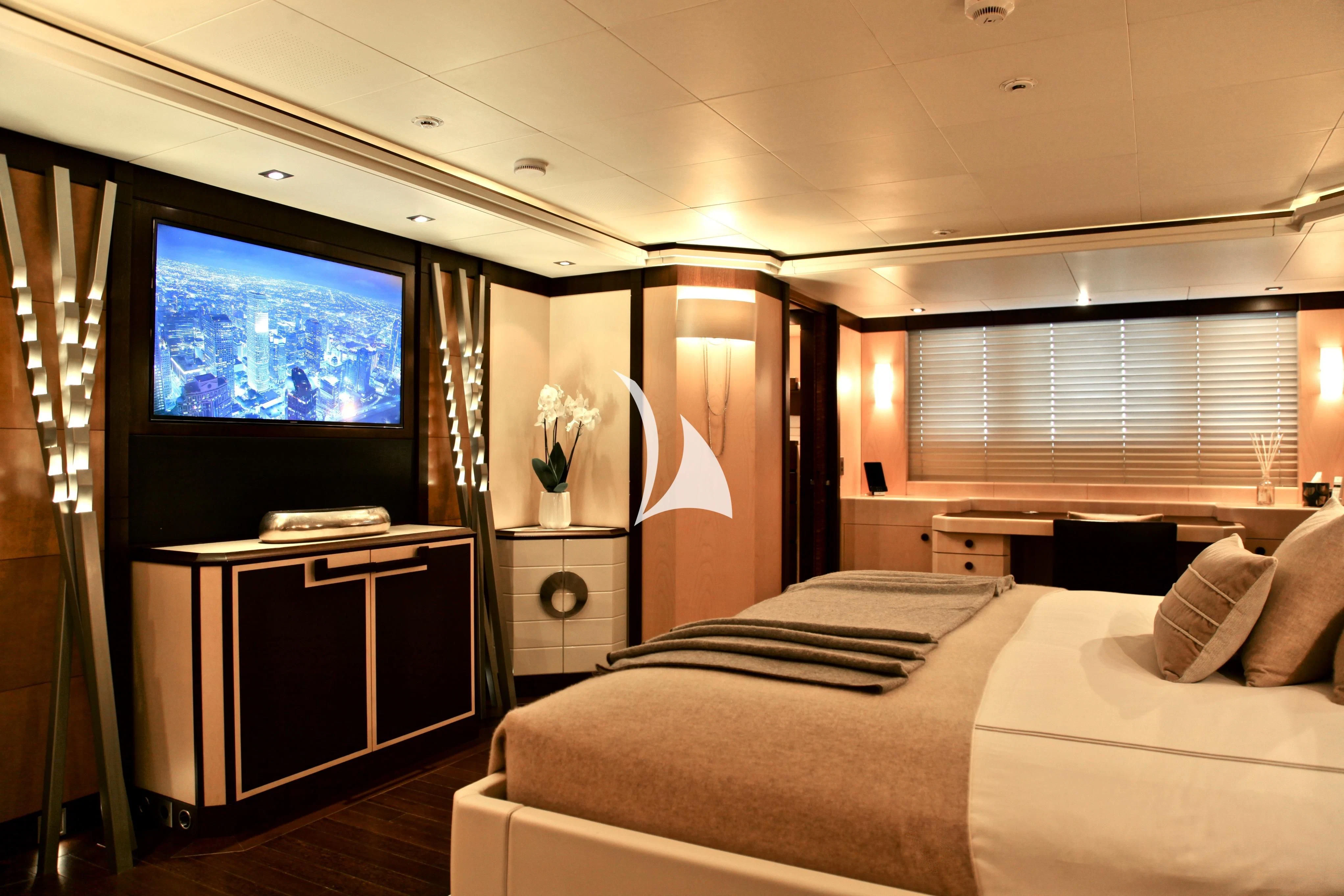 a bedroom with a large tv aboard ALALYA Yacht for Sale