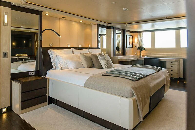a large bed in a room aboard ALALYA Yacht for Sale