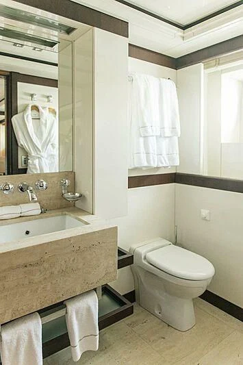 a bathroom with a large mirror aboard ALALYA Yacht for Sale