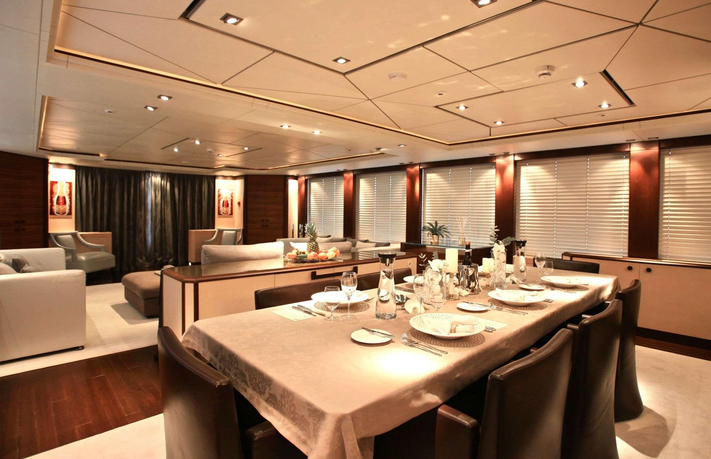 a large room with a table and chairs aboard ALALYA Yacht for Sale