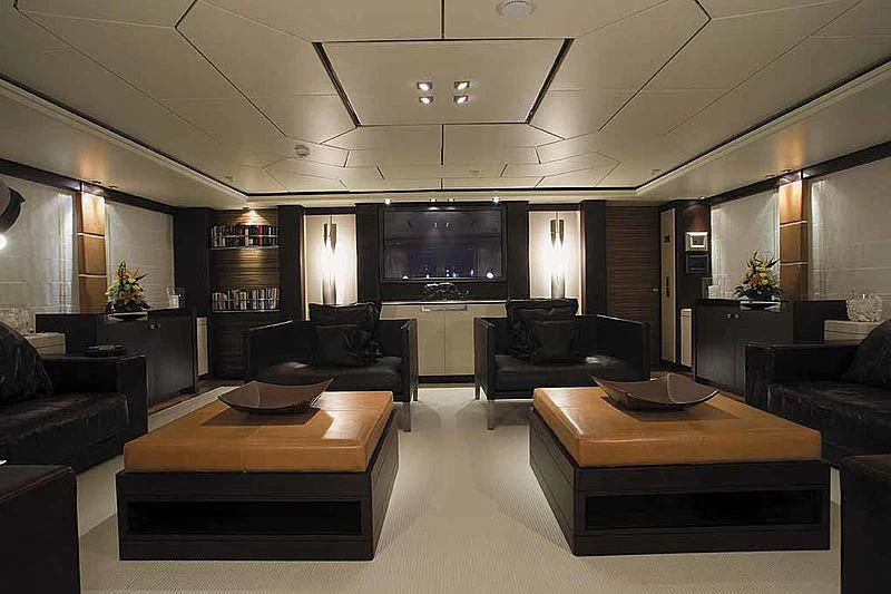a room with leather couches and a television aboard ALALYA Yacht for Sale