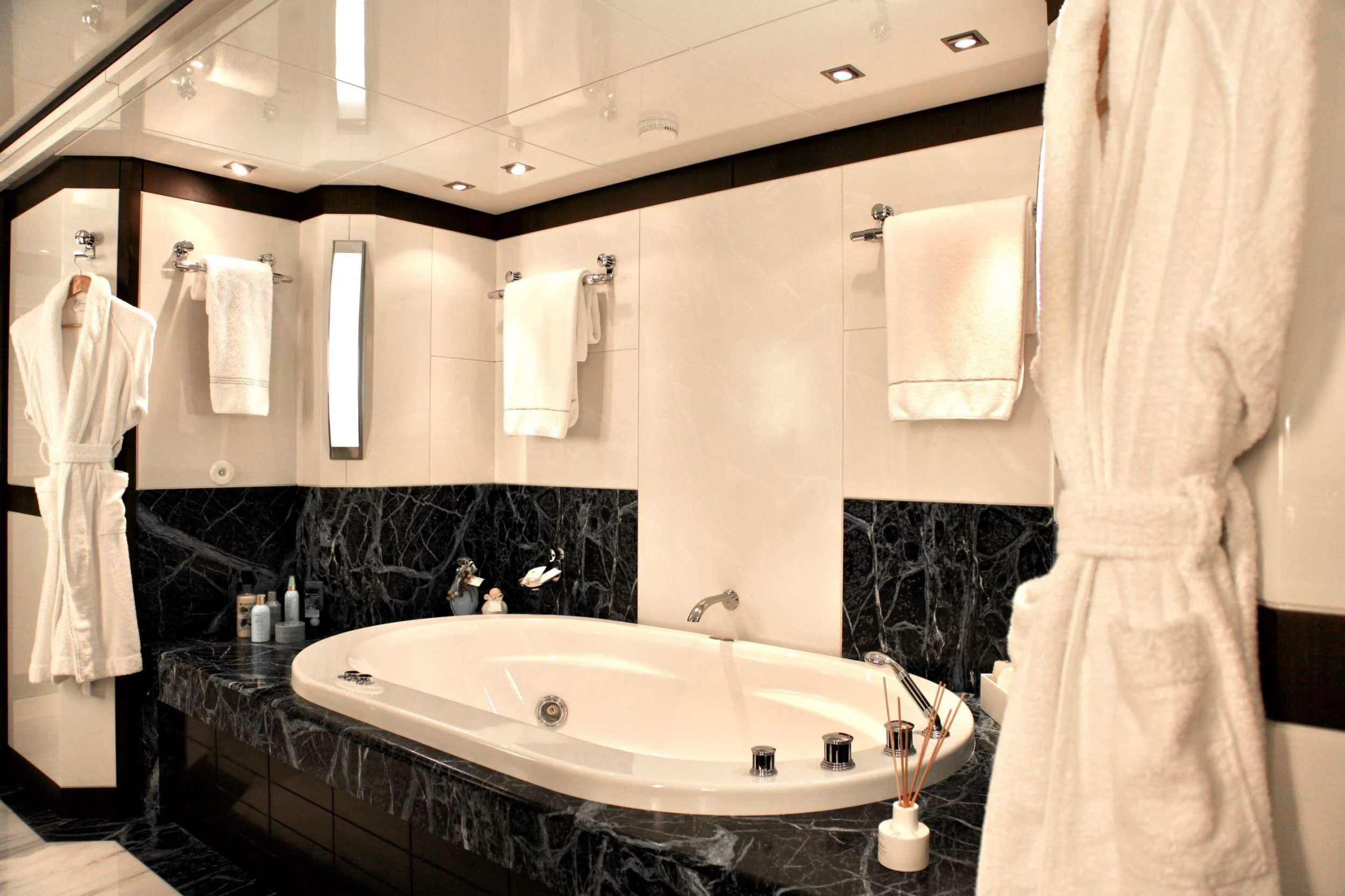 a bathroom with a bathtub and a sink aboard ALALYA Yacht for Sale