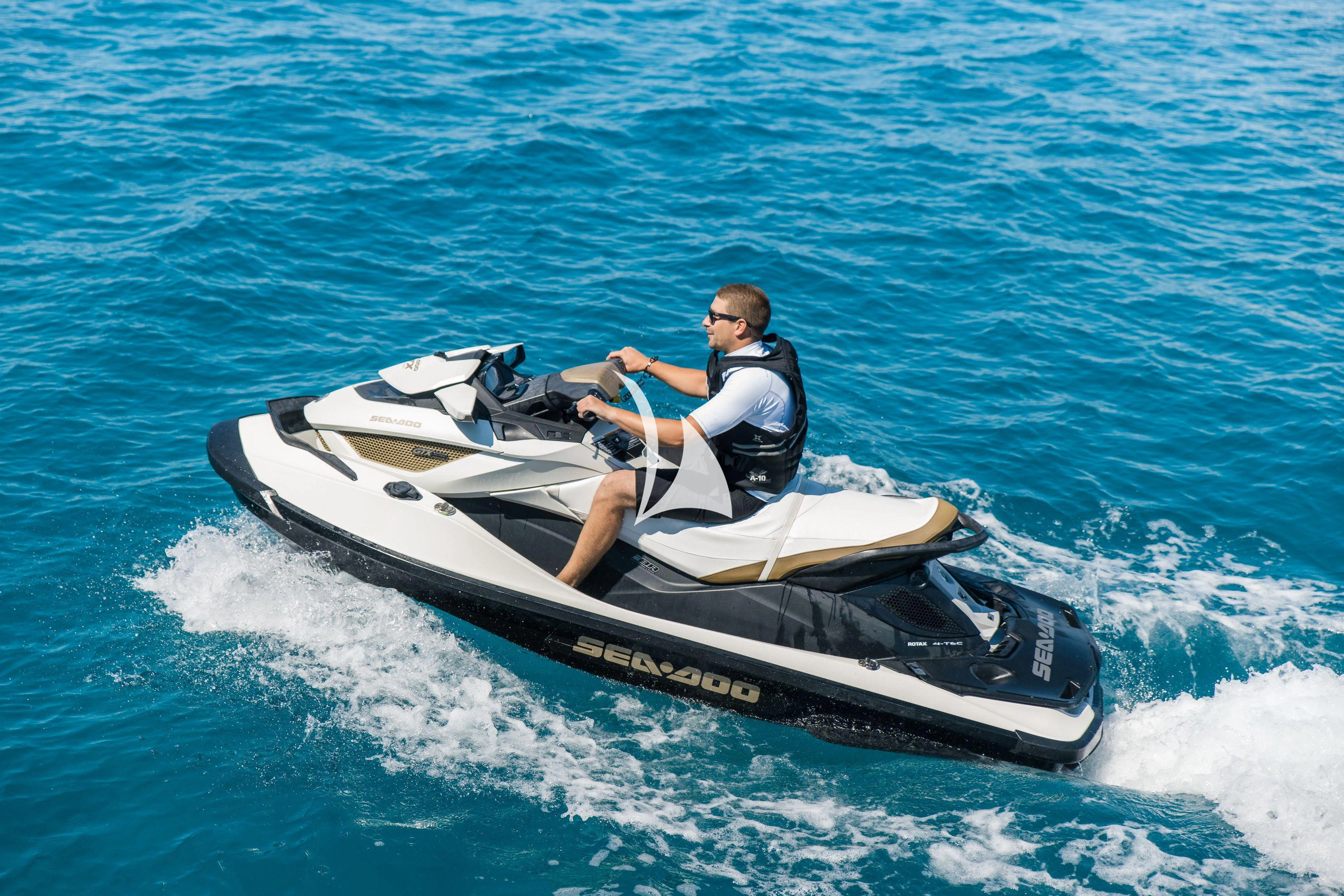 a man riding a jet ski aboard ALALYA Yacht for Sale