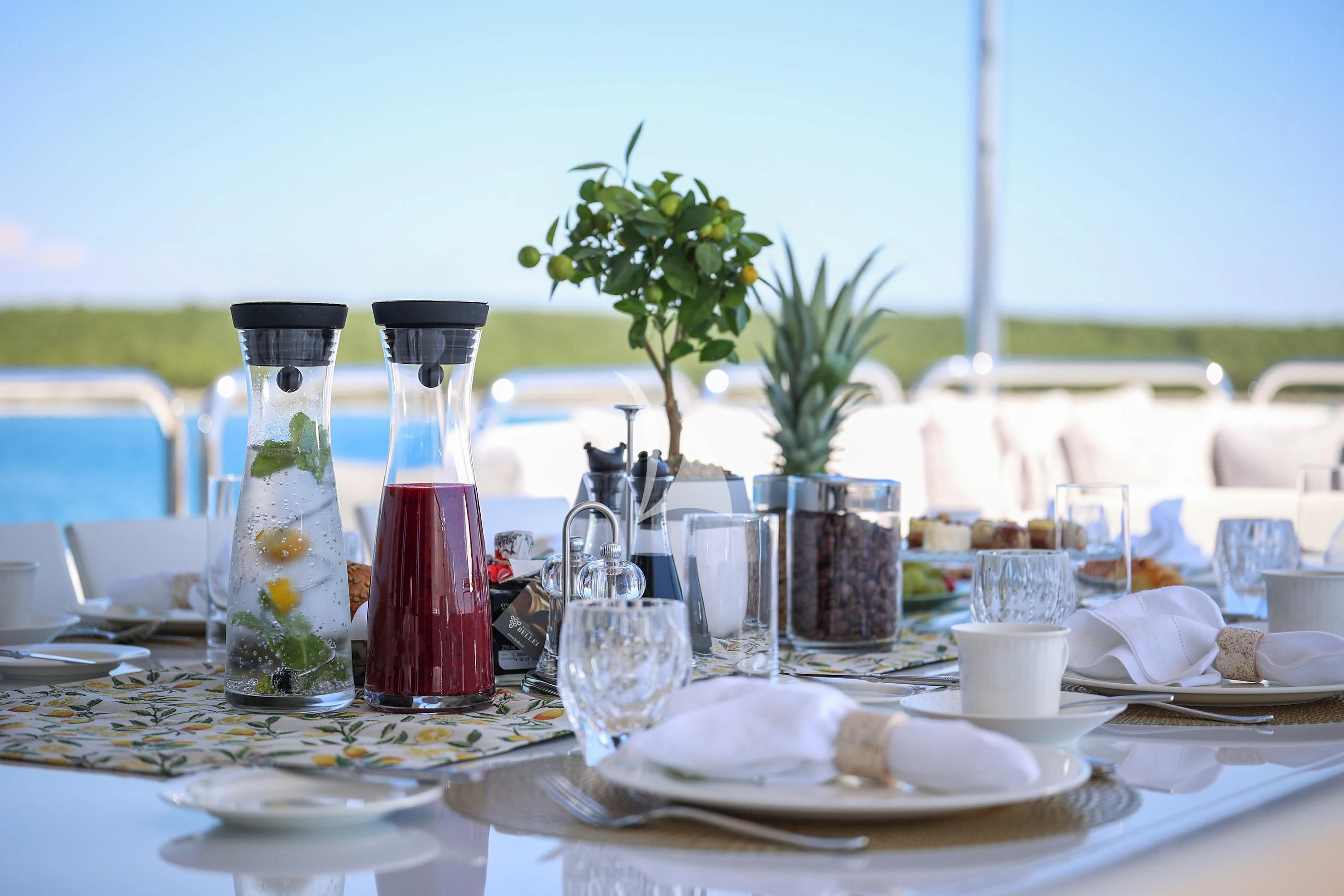 a table with plates and glasses aboard ALALYA Yacht for Sale