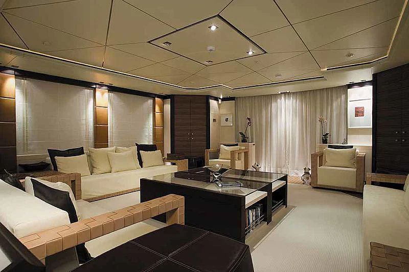 a large room with a table and chairs aboard ALALYA Yacht for Sale