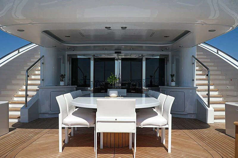 a room with a table and chairs aboard ALALYA Yacht for Sale