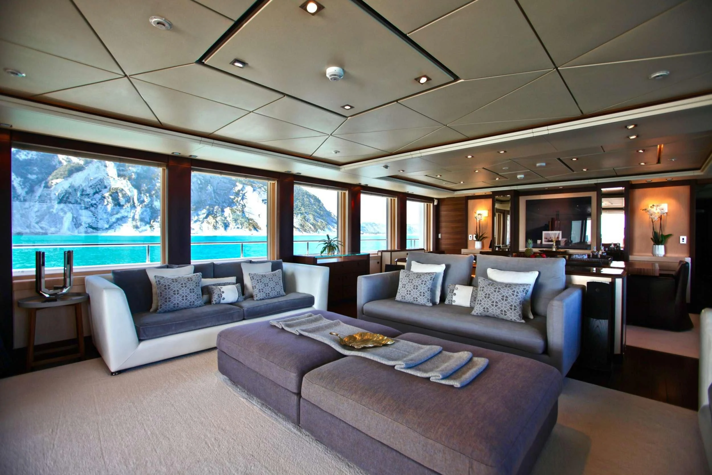 a living room with a large window aboard ALALYA Yacht for Sale