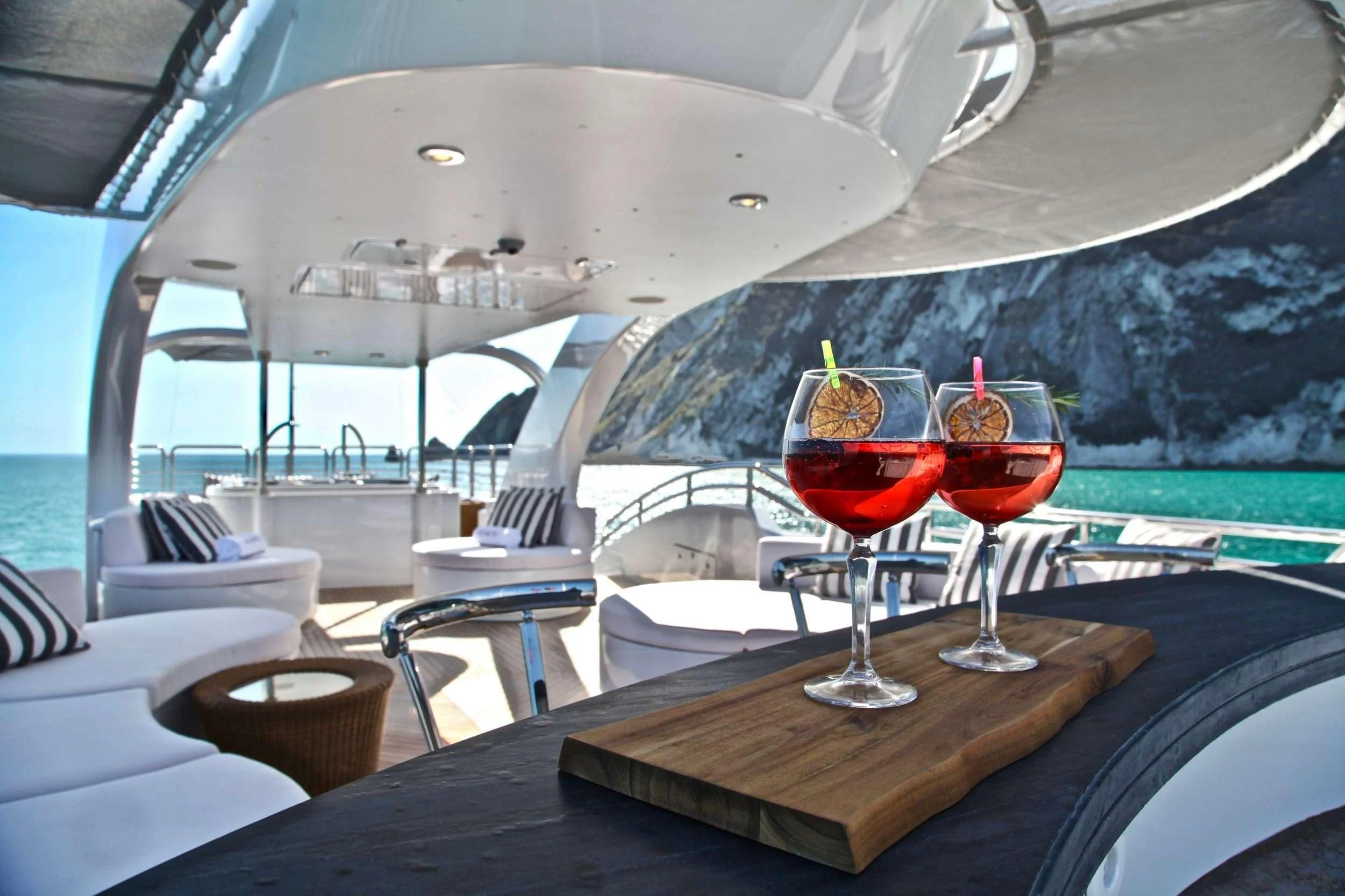a couple of glasses of wine on a boat aboard ALALYA Yacht for Sale