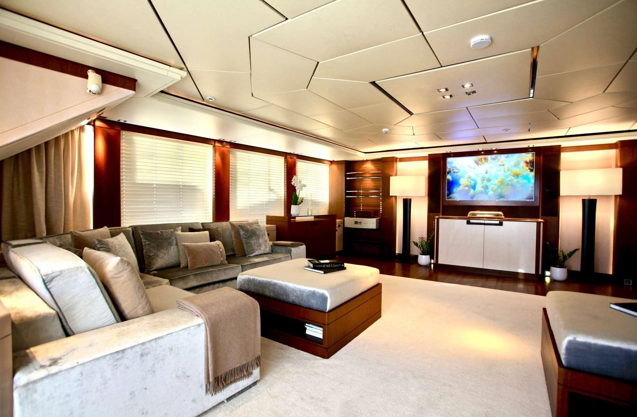 a living room with a large window aboard ALALYA Yacht for Sale