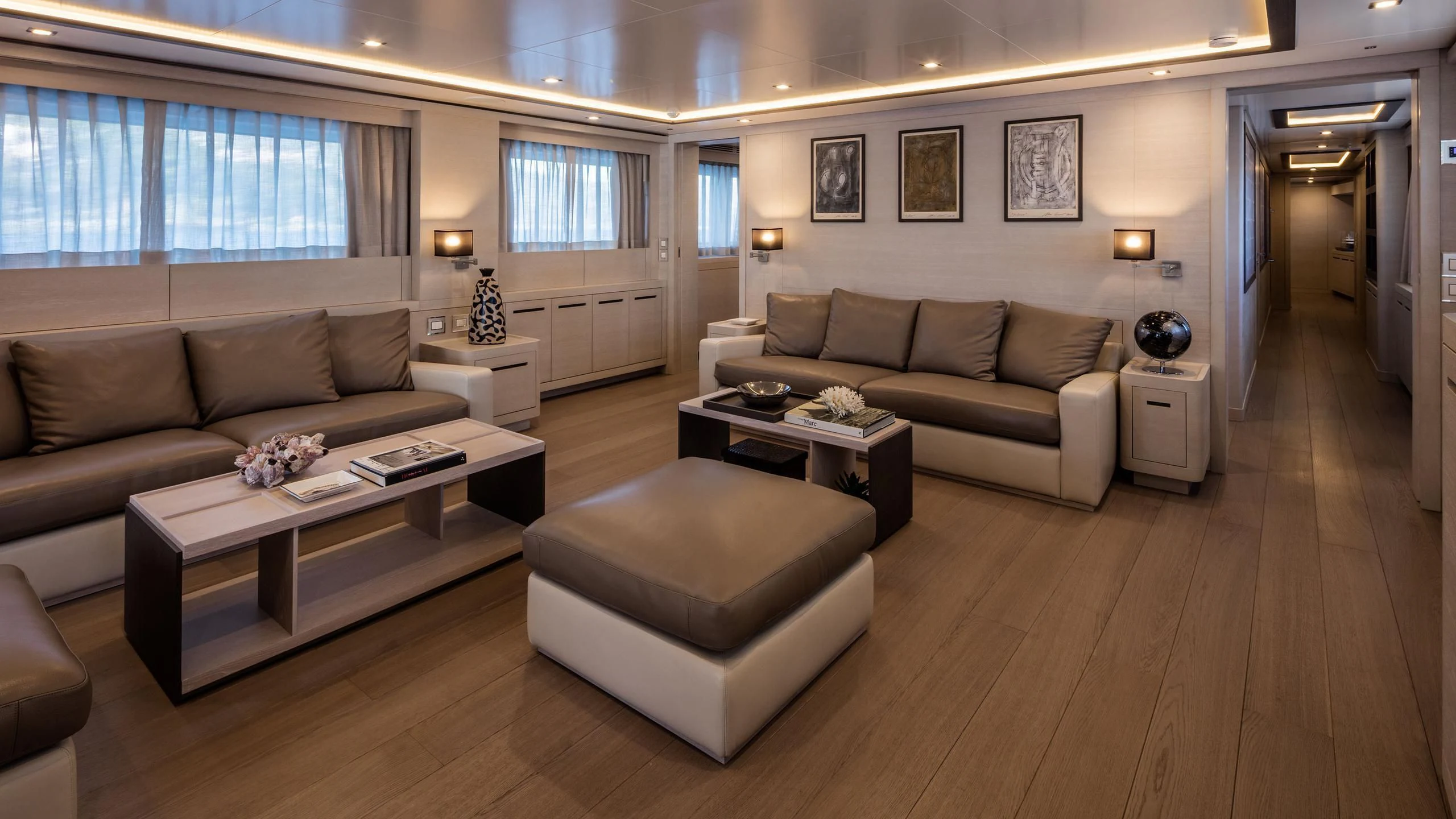 a living room with a couch and a coffee table aboard ALALYA Yacht for Sale
