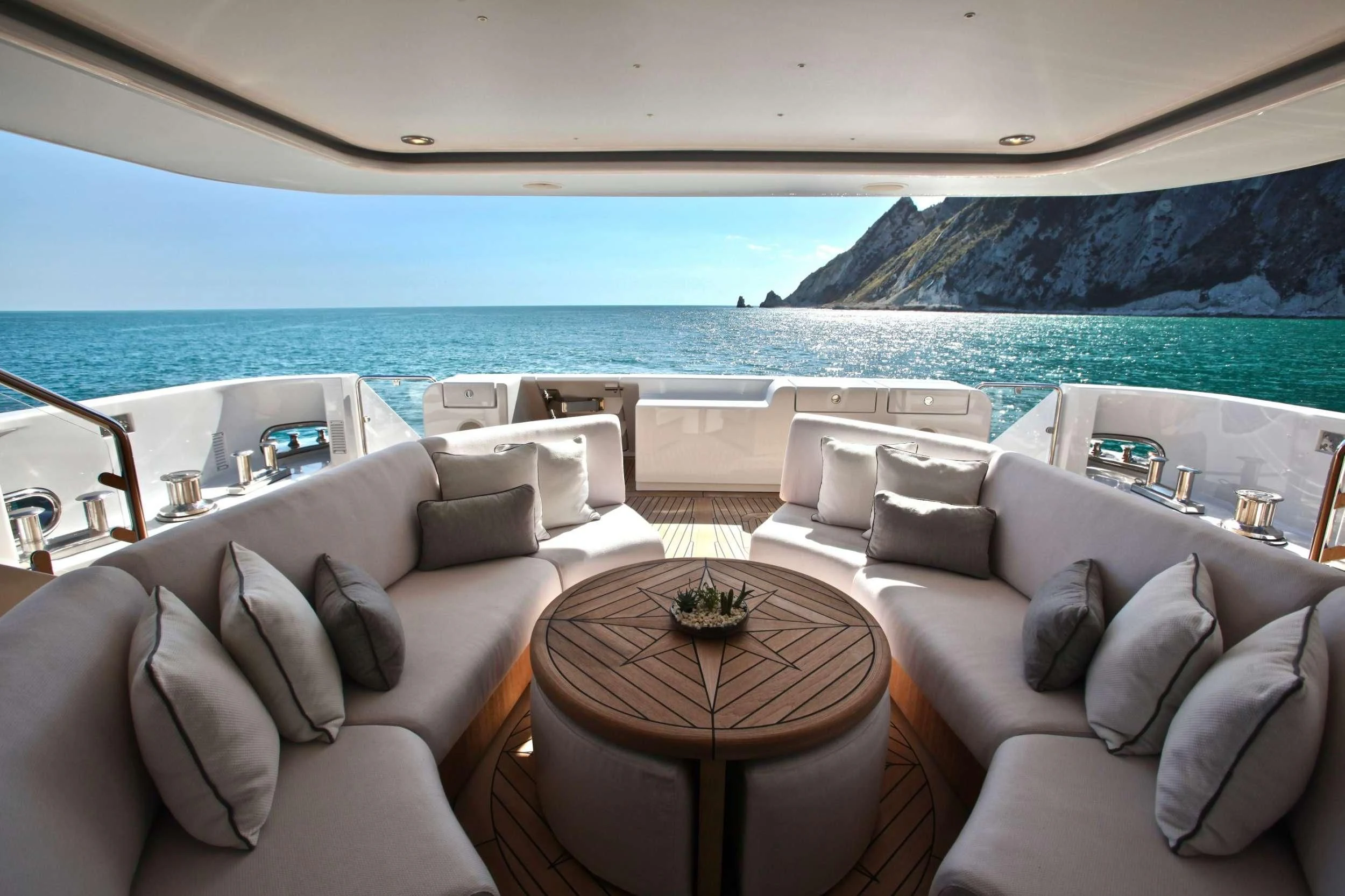 a room with a couch and a table and a view of the ocean aboard ALALYA Yacht for Sale