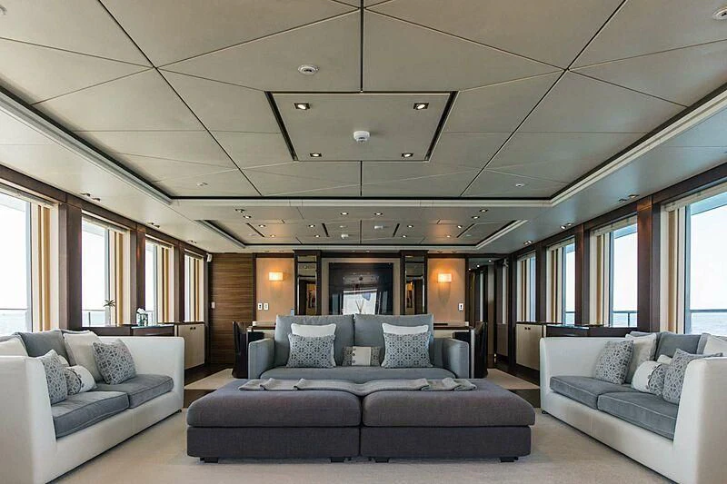 a large living room with a large bed and a large window aboard ALALYA Yacht for Sale