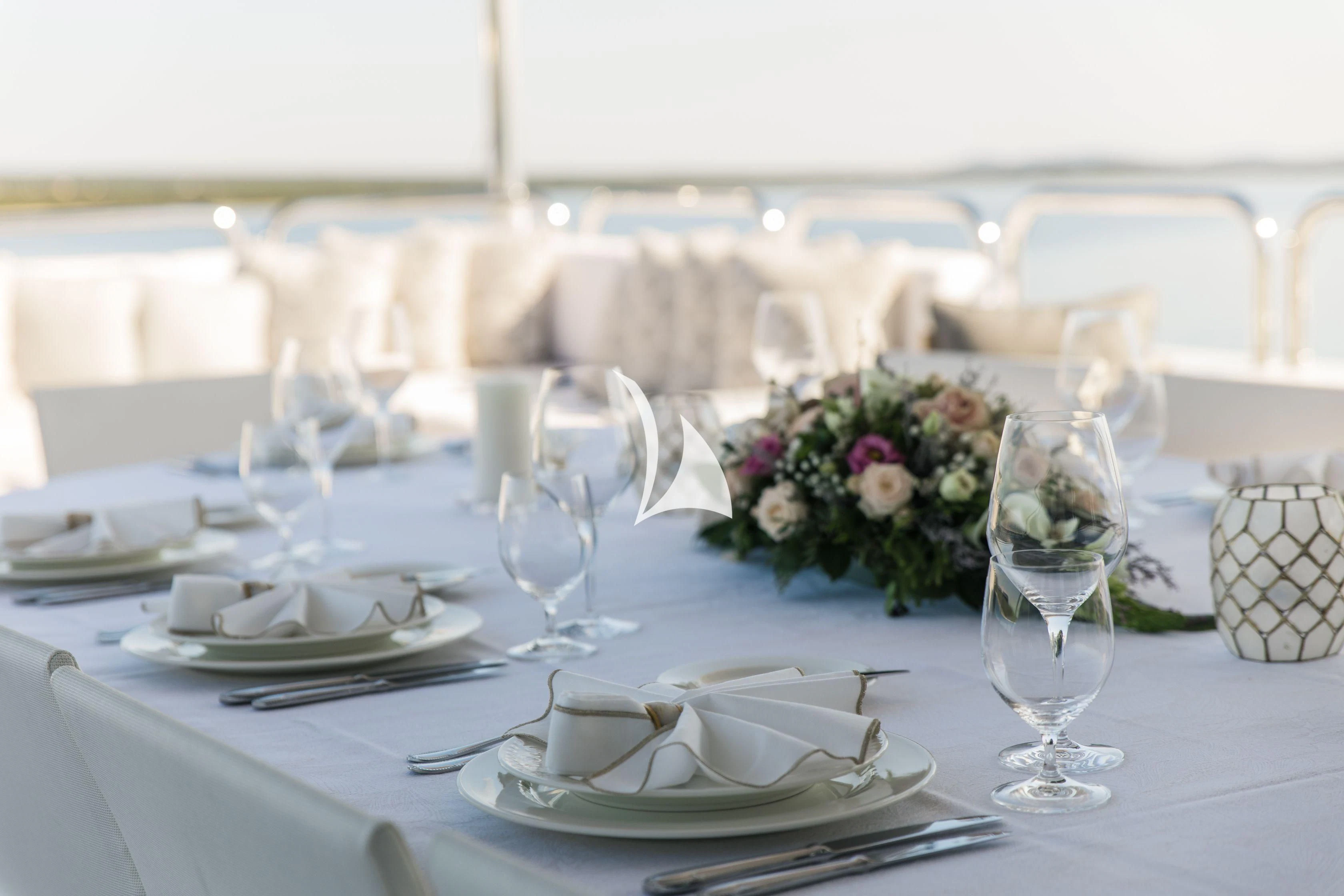 a table set with place settings aboard ALALYA Yacht for Sale