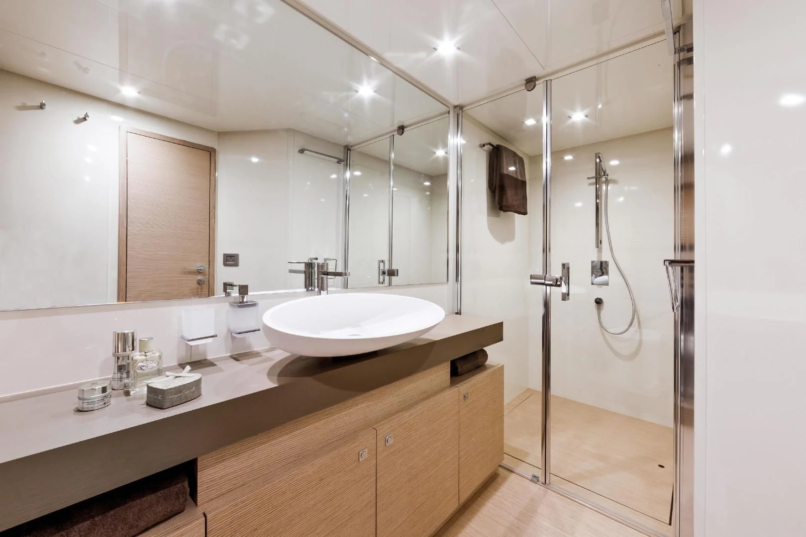 a bathroom with a sink and a shower aboard FERRETTI Yacht for Sale