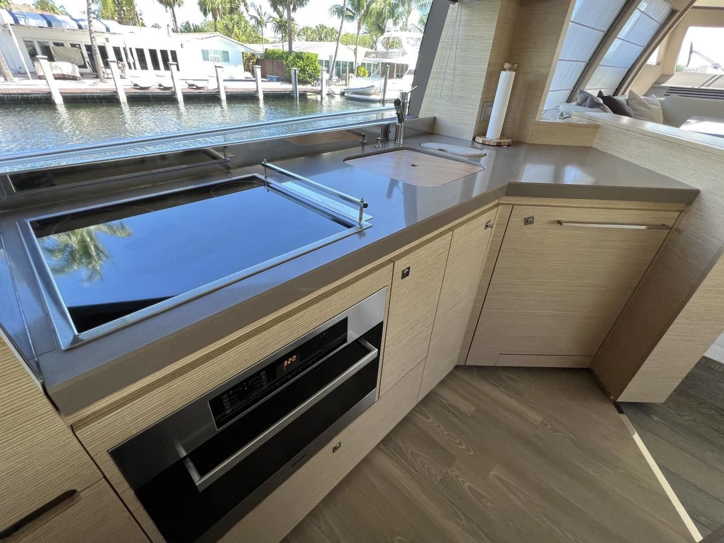 a kitchen with a large window aboard FERRETTI Yacht for Sale