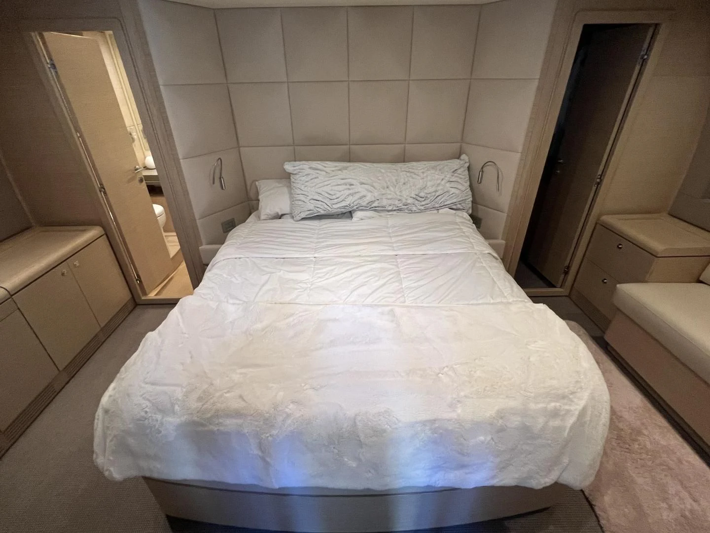 a bed with white sheets aboard FERRETTI Yacht for Sale