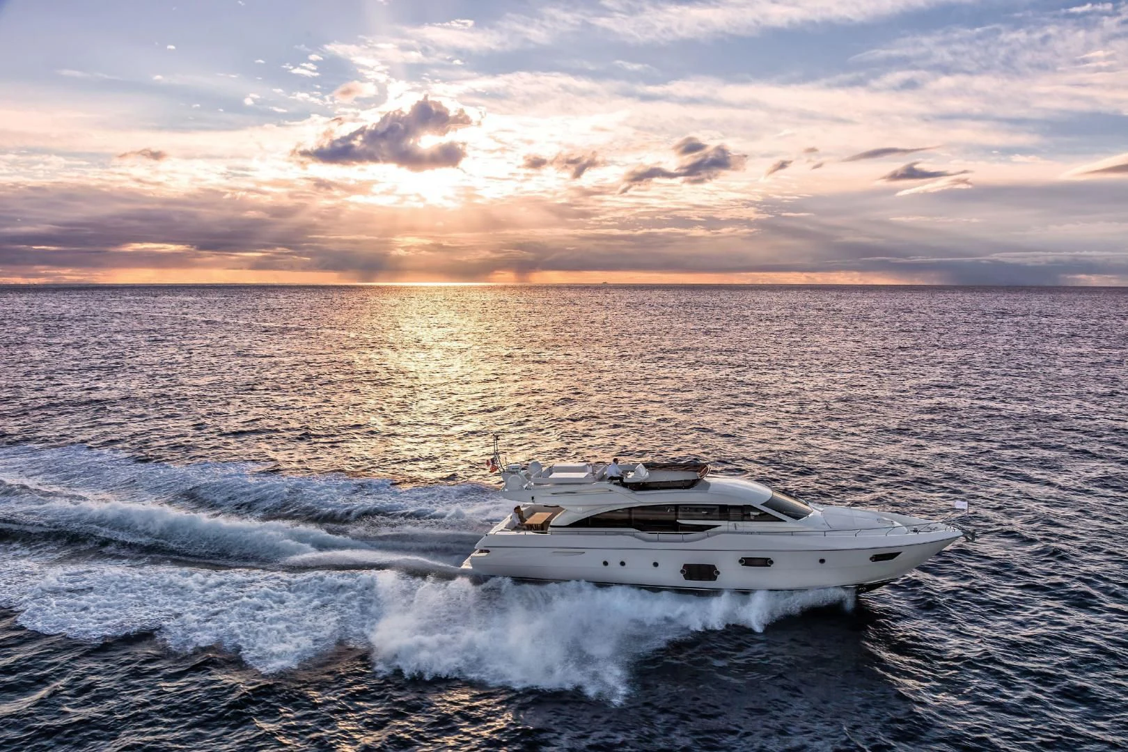 a white yacht in the water aboard FERRETTI Yacht for Sale