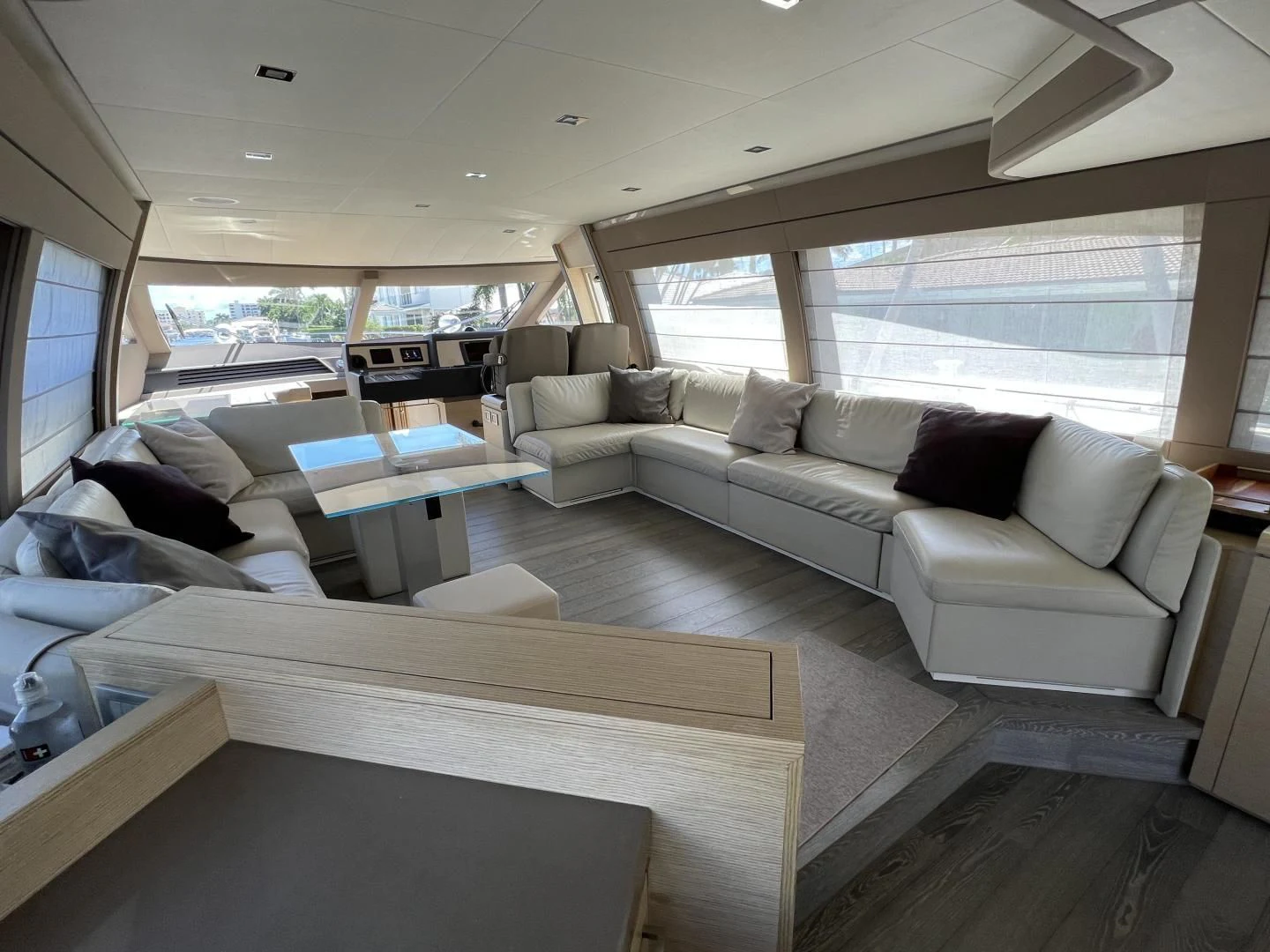 a living room with a couch and a table aboard FERRETTI Yacht for Sale