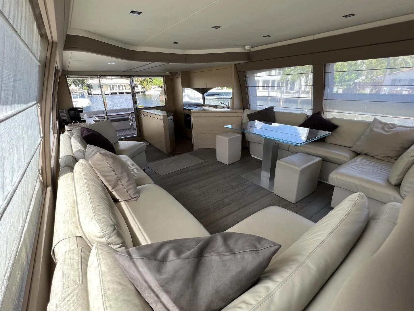 a living room with a large window aboard FERRETTI Yacht for Sale
