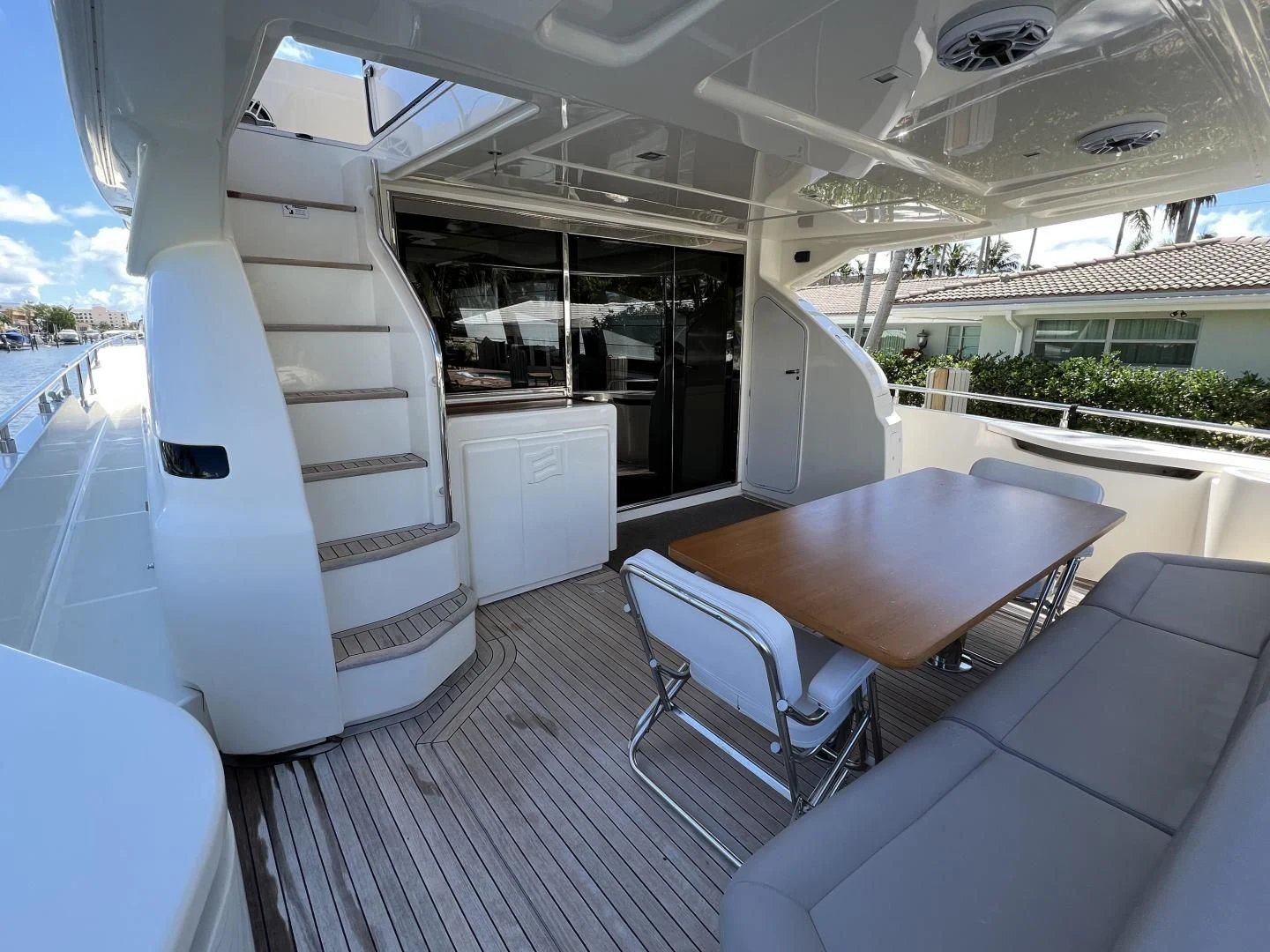 a boat with a table and chairs aboard FERRETTI Yacht for Sale
