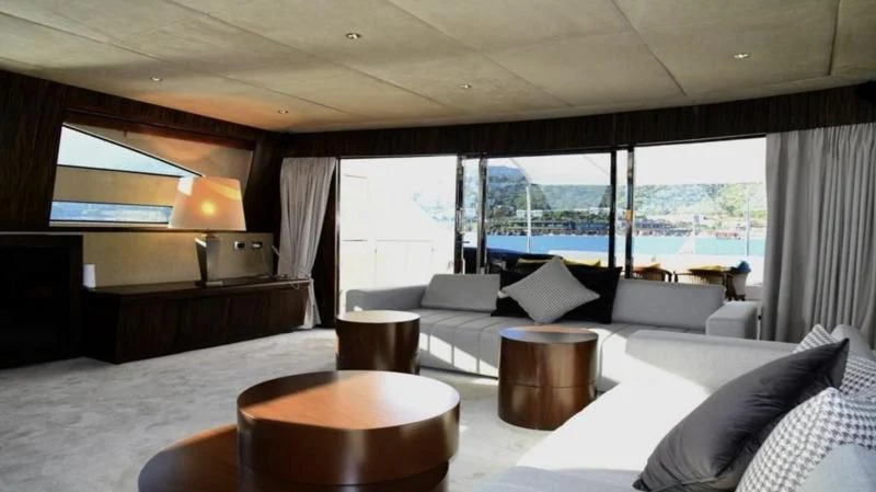 a large room with a bed and a table aboard KAYANNI Yacht for Sale
