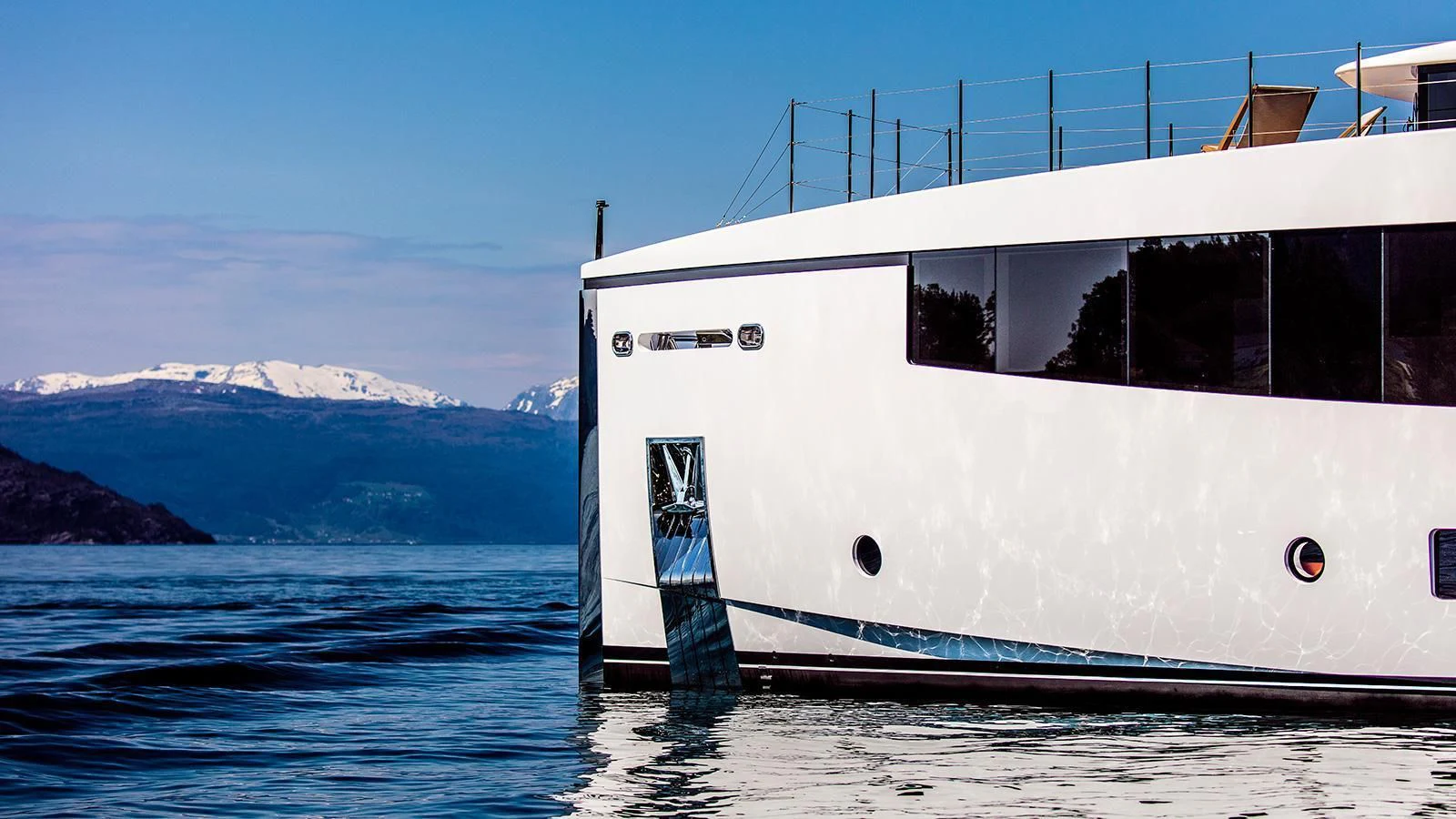a white boat on the water aboard KAMINO Yacht for Sale