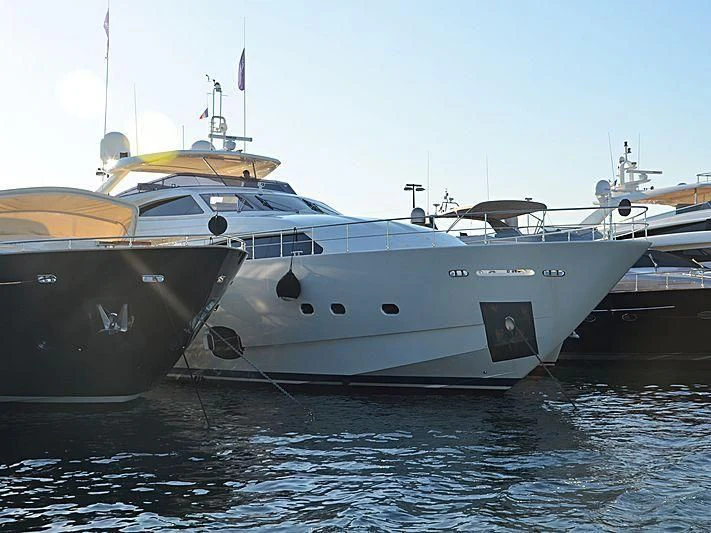 a large white boat in the water aboard THINK BIG Yacht for Sale