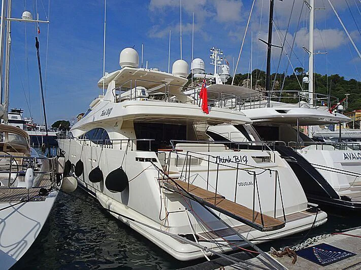 a boat docked at a pier aboard THINK BIG Yacht for Sale