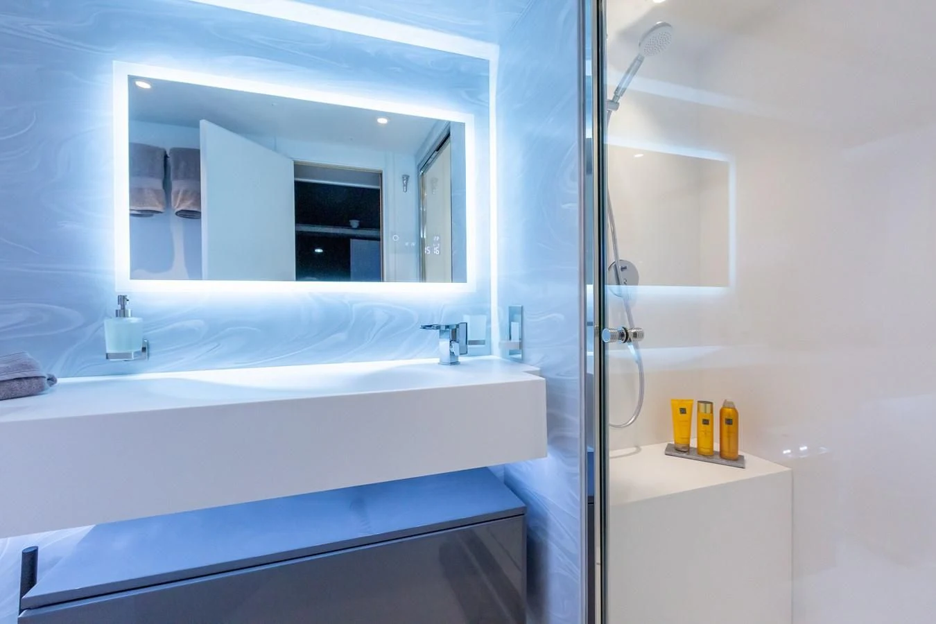 a bathroom with a large mirror aboard THINK BIG Yacht for Sale