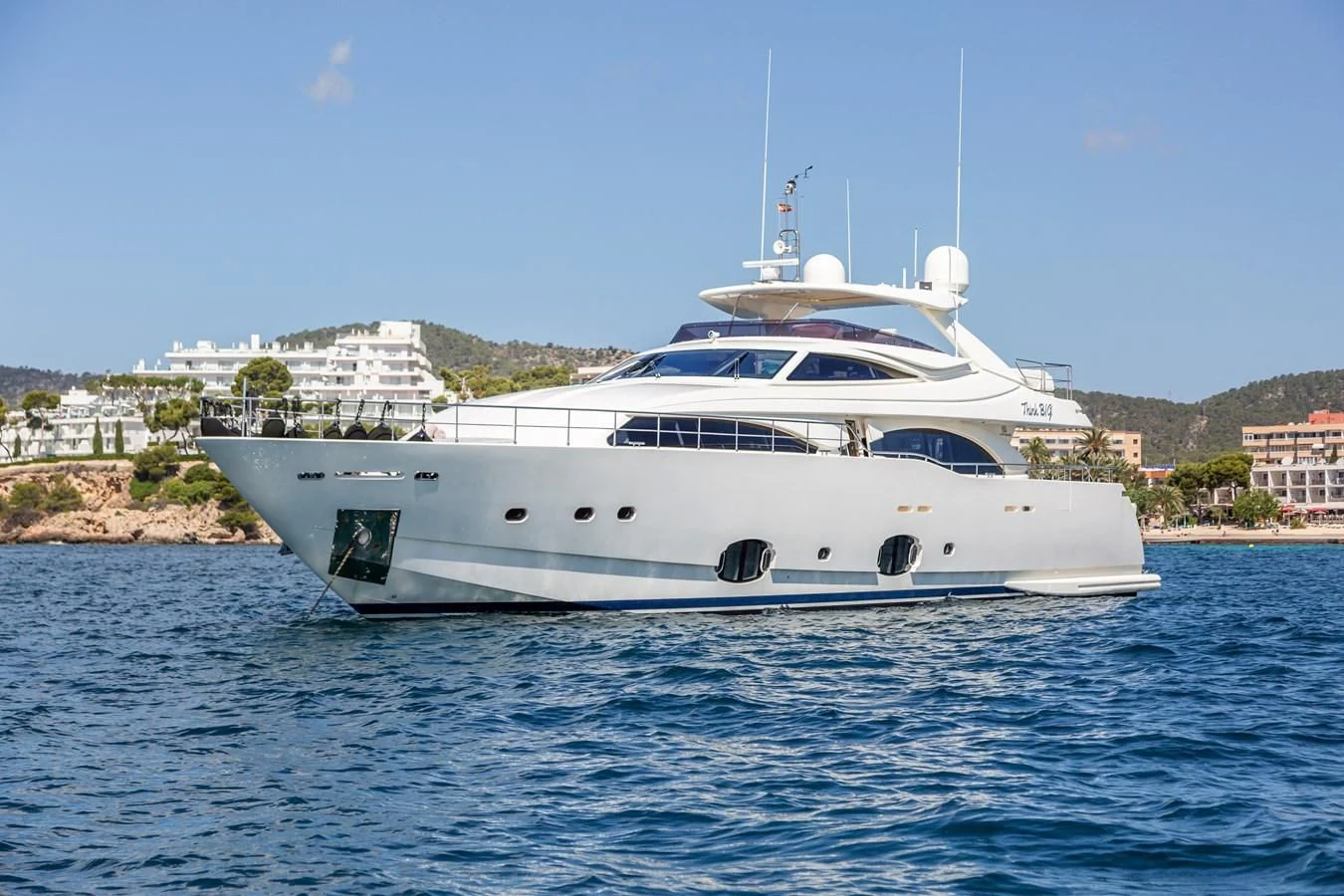 a white yacht in the water aboard THINK BIG Yacht for Sale
