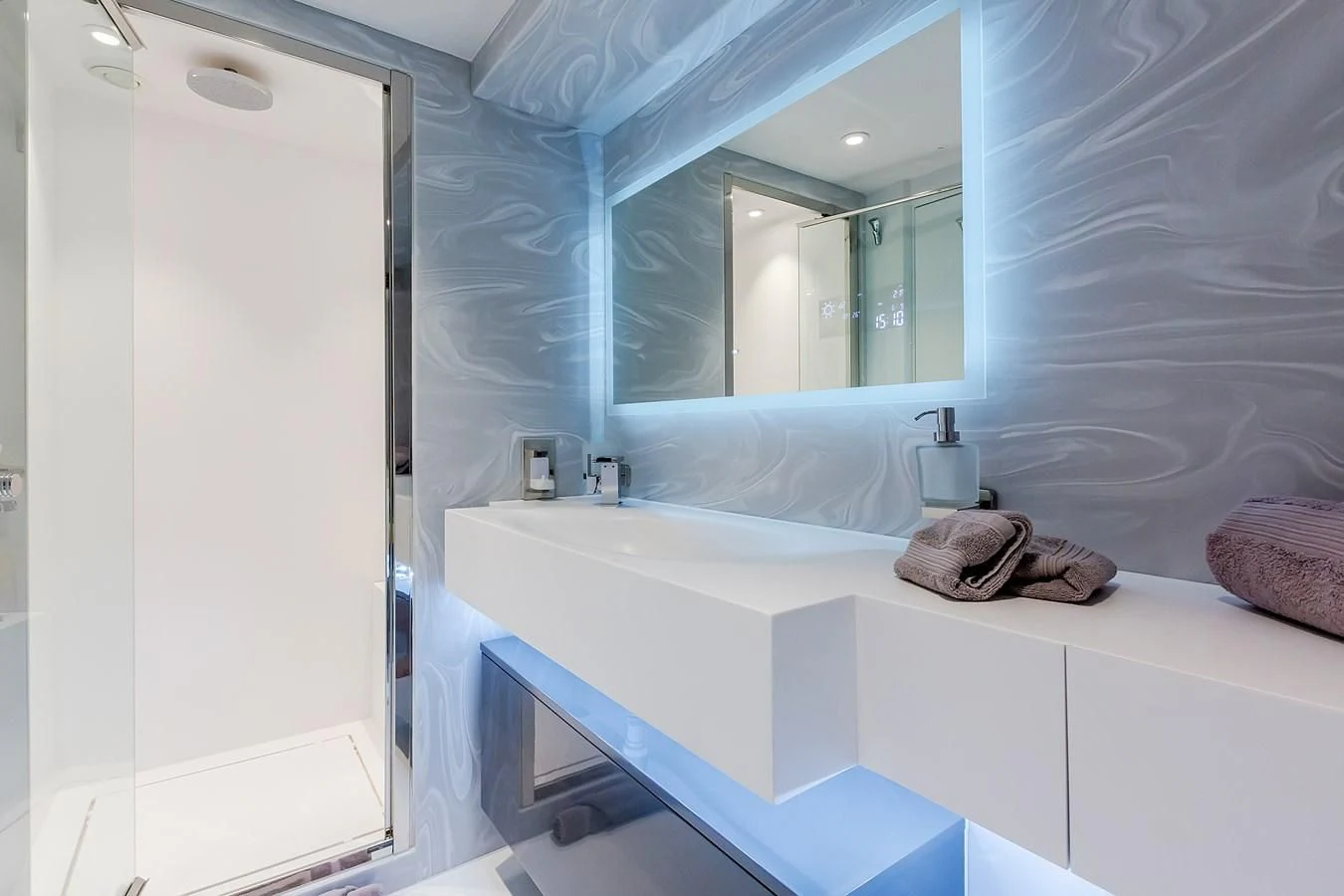a bathroom with a large mirror aboard THINK BIG Yacht for Sale