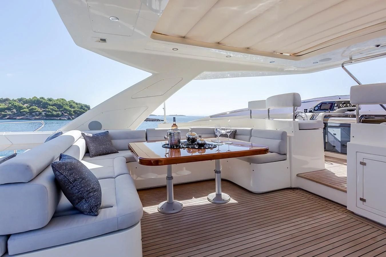 a boat with a table and chairs aboard THINK BIG Yacht for Sale