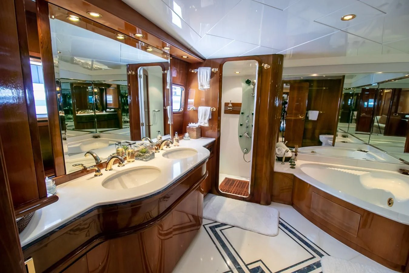 a bathroom with a large mirror aboard SHALIMAR Yacht for Sale