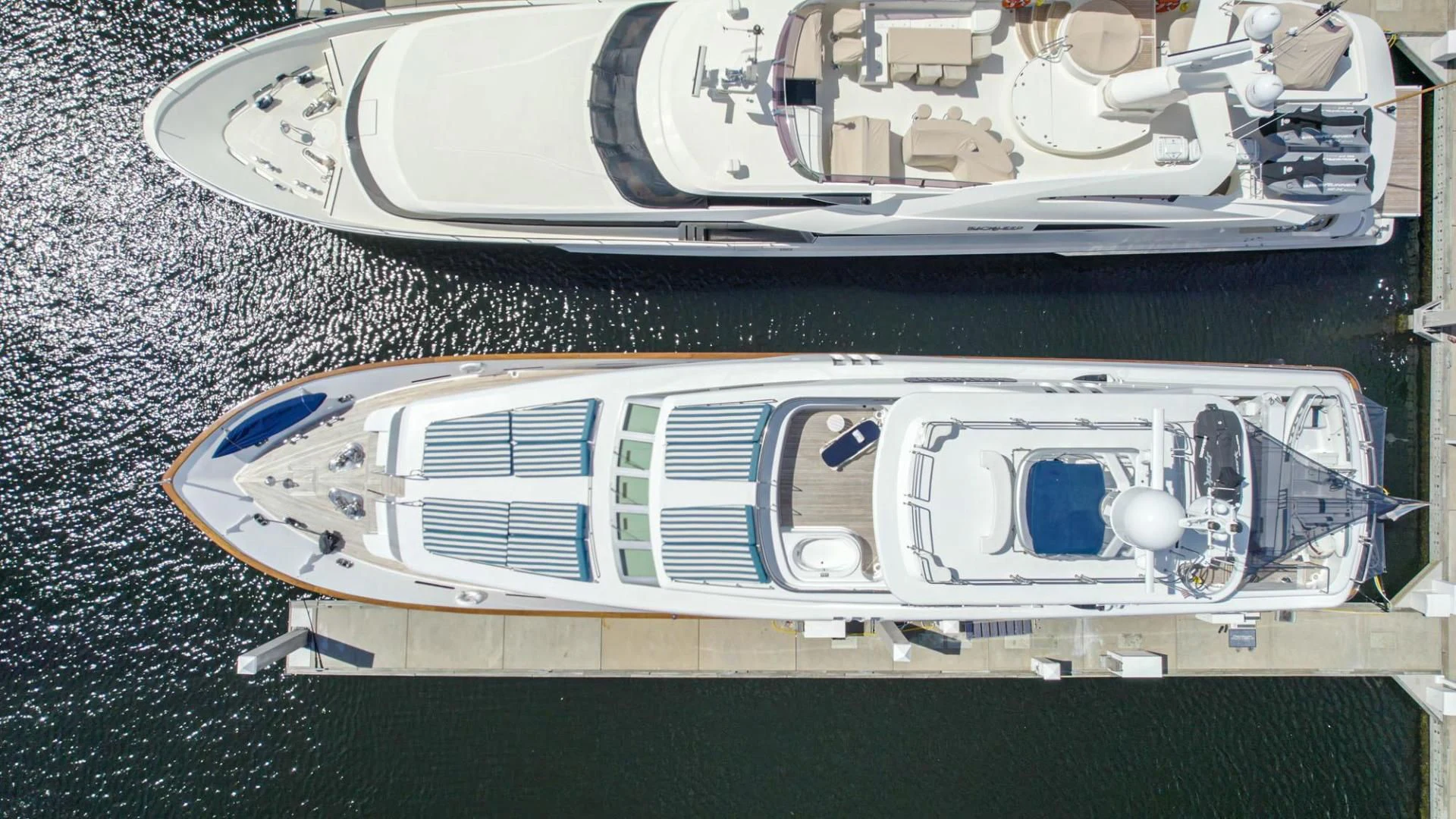 a silver car with a blue logo aboard SHALIMAR Yacht for Sale
