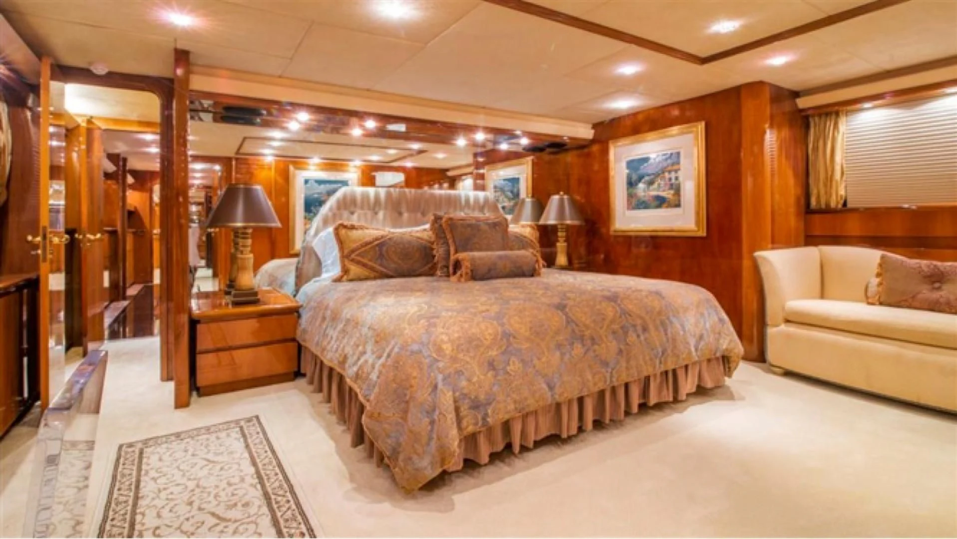 a large bedroom with a large bed aboard SHALIMAR Yacht for Sale