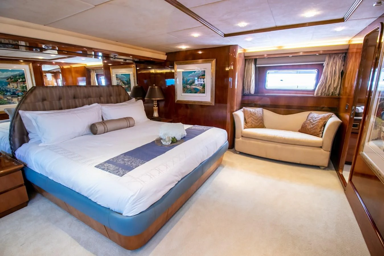 a room with a bed and a couch aboard SHALIMAR Yacht for Sale