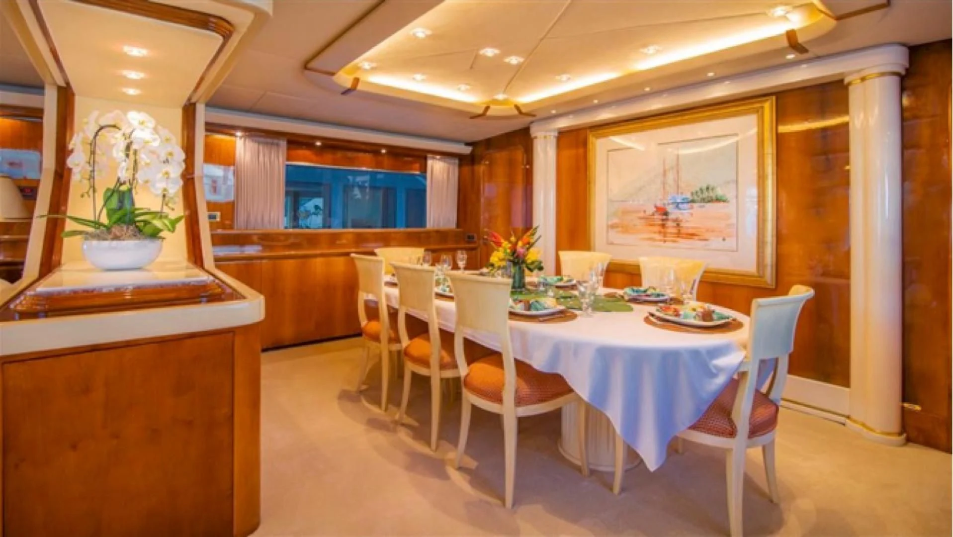 a room with tables and chairs aboard SHALIMAR Yacht for Sale