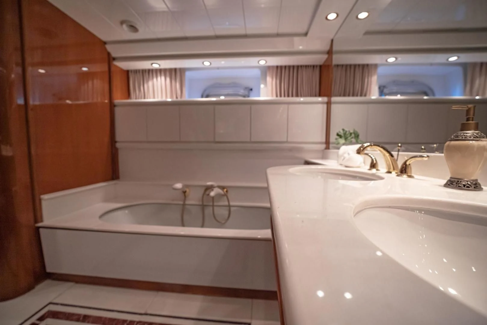 a bathroom with a bathtub and sink aboard SHALIMAR Yacht for Sale