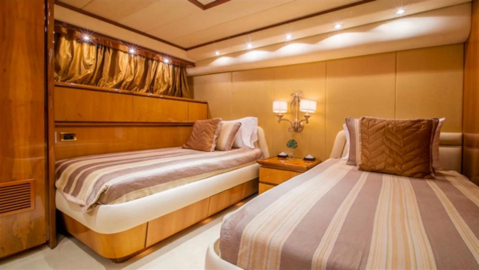 a couple of beds in a hotel room aboard SHALIMAR Yacht for Sale