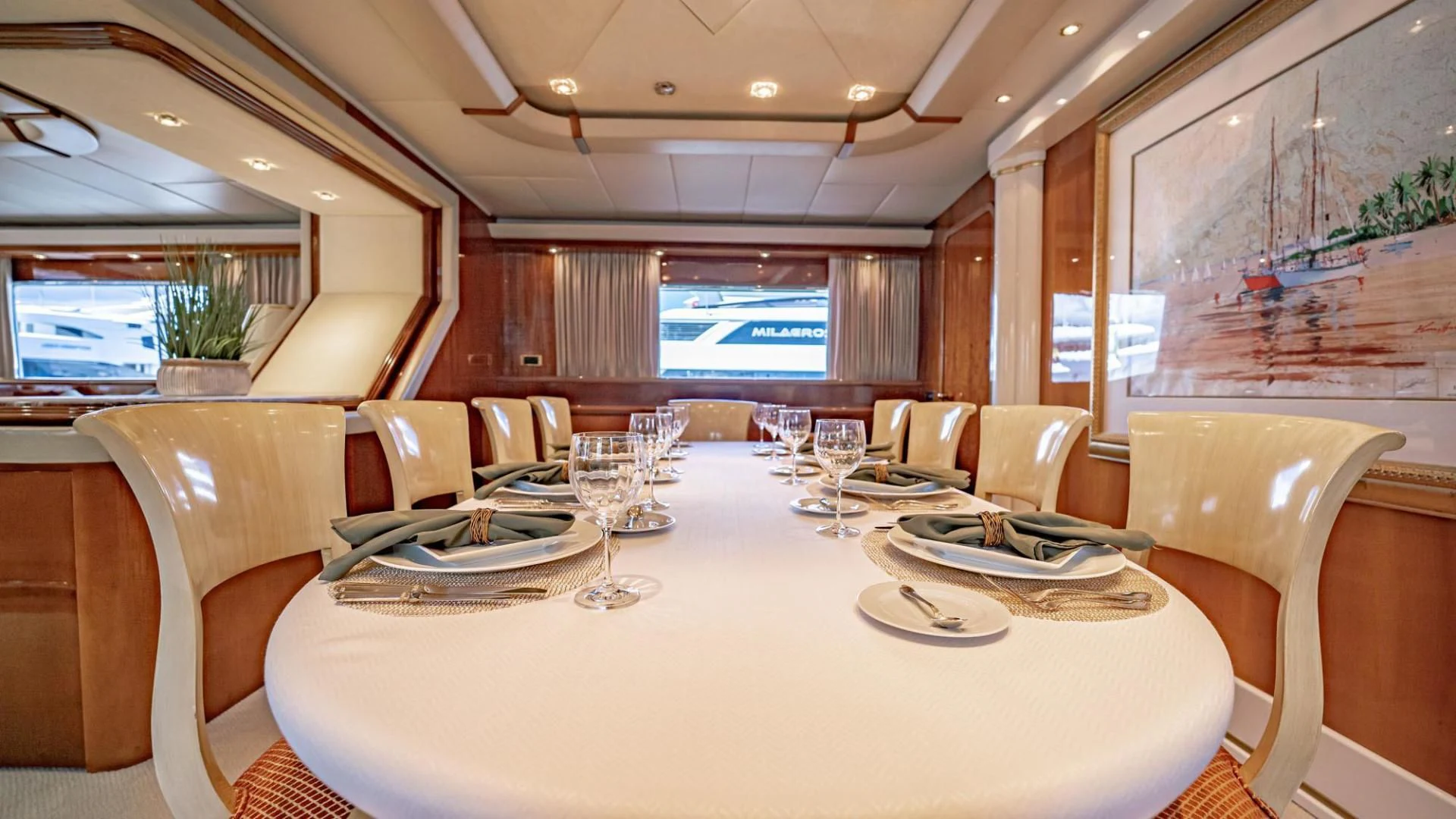 a large room with tables and chairs aboard SHALIMAR Yacht for Sale