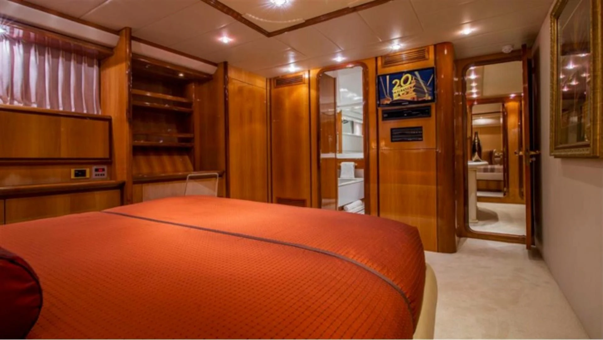 a bedroom with a bed and a closet aboard SHALIMAR Yacht for Sale