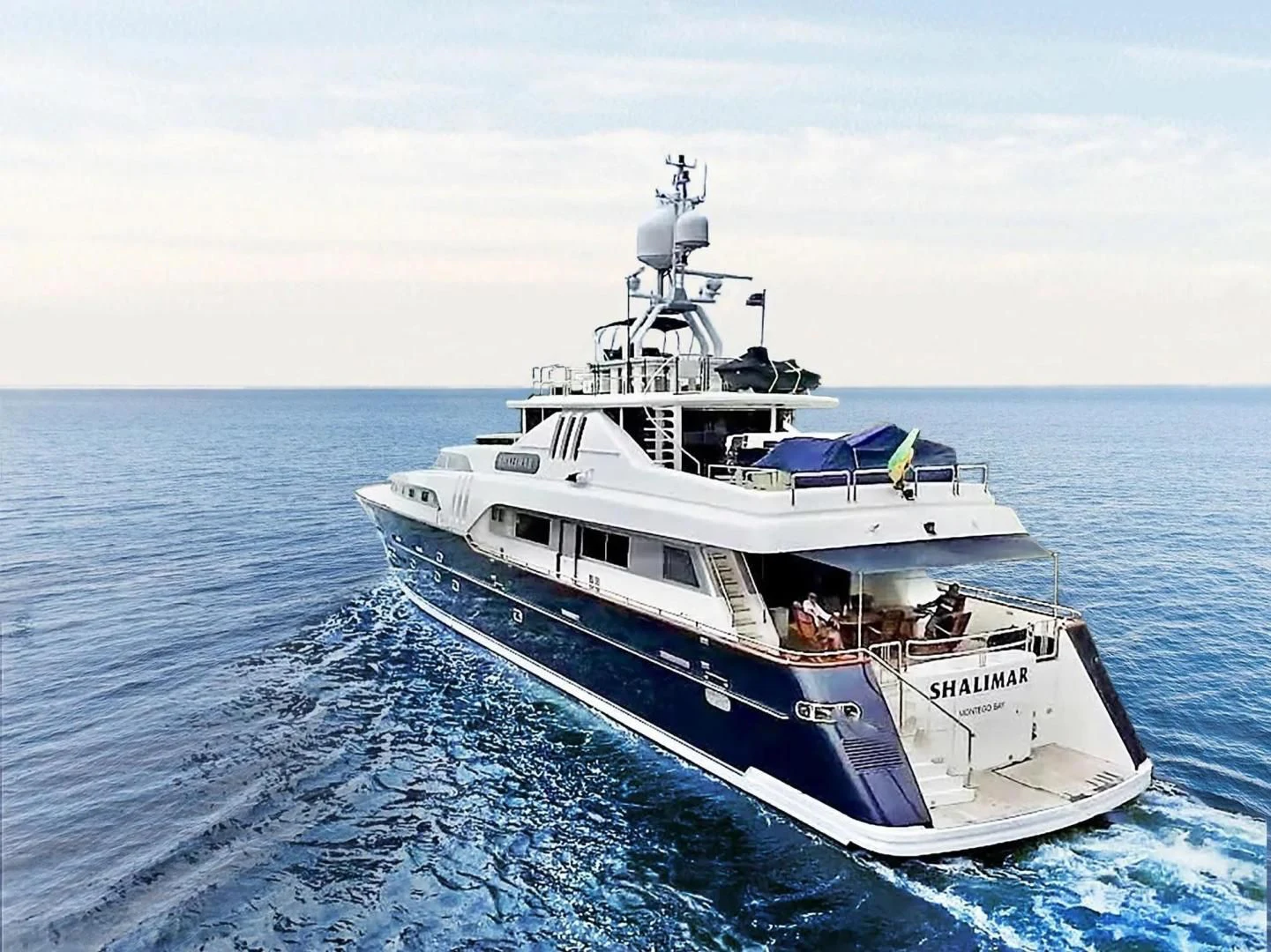a large white boat in the water aboard SHALIMAR Yacht for Sale