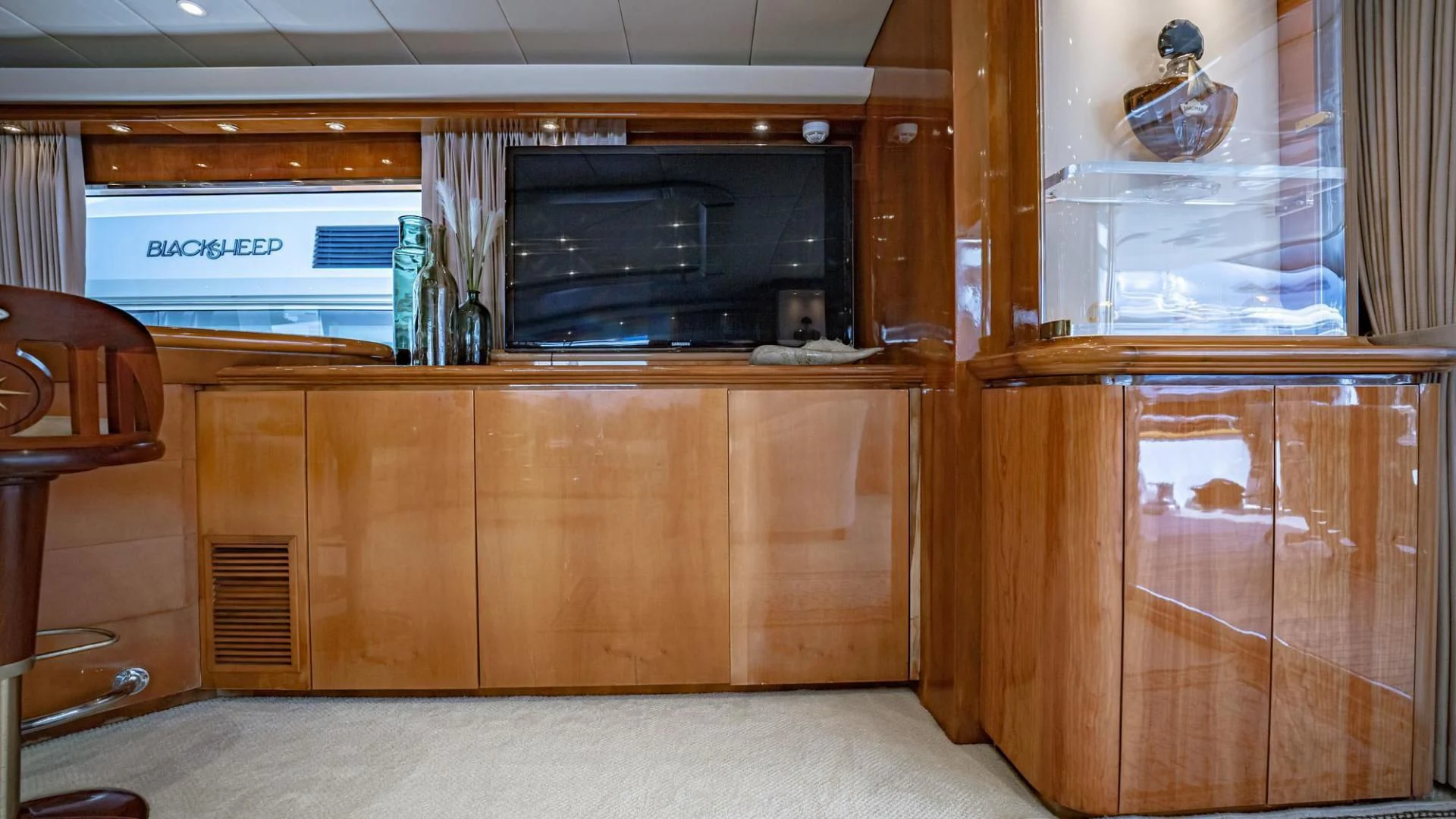a room with wooden cabinets and a television aboard SHALIMAR Yacht for Sale