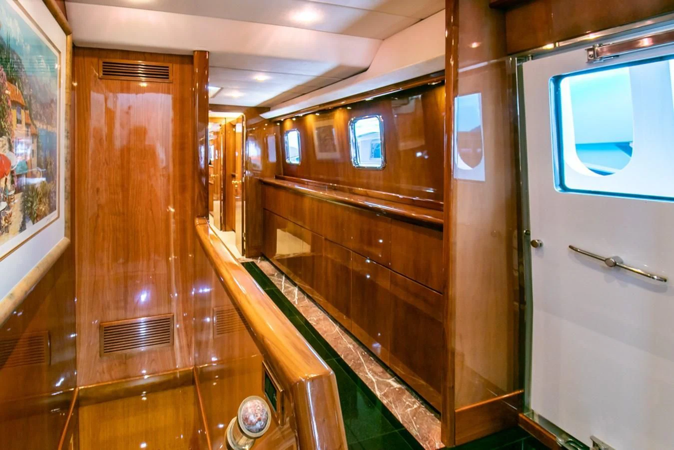 a hallway with wooden cabinets aboard SHALIMAR Yacht for Sale