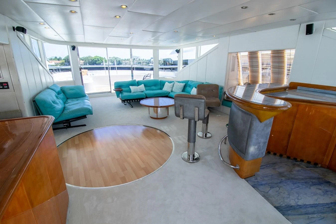 a room with couches and tables aboard SHALIMAR Yacht for Sale